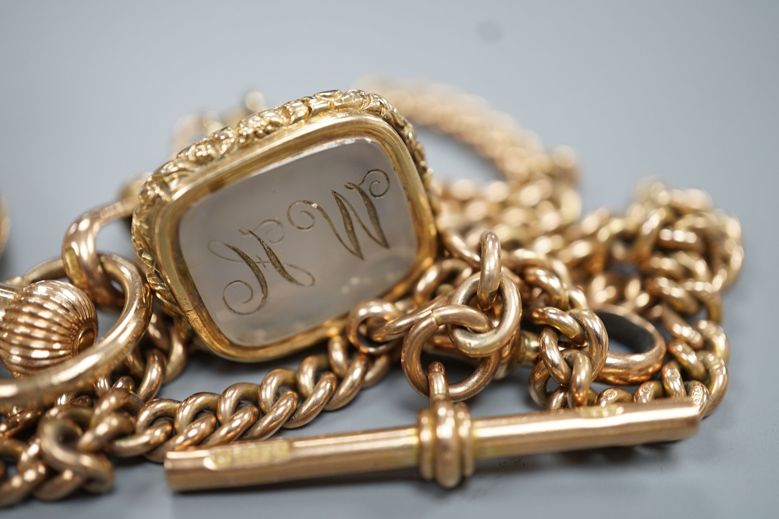 A 1920's 9ct gold Waltham keyless half hunter pocket watch, on a 9ct gold albert, hung with a Victorian yellow metal overlaid and carnelian set fob seal